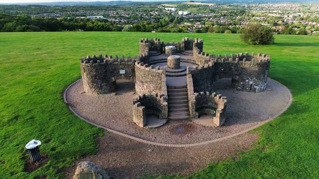 Aerial view of a heritage monument in parkland